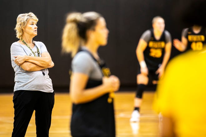 Iowa head coach Lisa Bluder, left, watches players during a summer Hawkeyes women's basketball practice, Thursday, July 1, 2021, at Carver-Hawkeye Arena in Iowa City, Iowa.