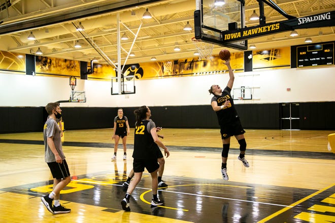 Iowa center Monika Czinano (25) makes a basket during a summer Hawkeyes women's basketball practice, Thursday, July 1, 2021, at Carver-Hawkeye Arena in Iowa City, Iowa.