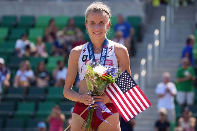 Jun 26, 2021; Eugene, OR, USA; Karissa Schweizer poses with the United states flag and silver medal after placing second in the women's 10,000m in 31:16.52 during the US Olympic Team Trials at Hayward Field. Mandatory Credit: Kirby Lee-USA TODAY Sports ORG XMIT: IMAGN-453052 ORIG FILE ID:  20210626_lbm_al2_082.JPG