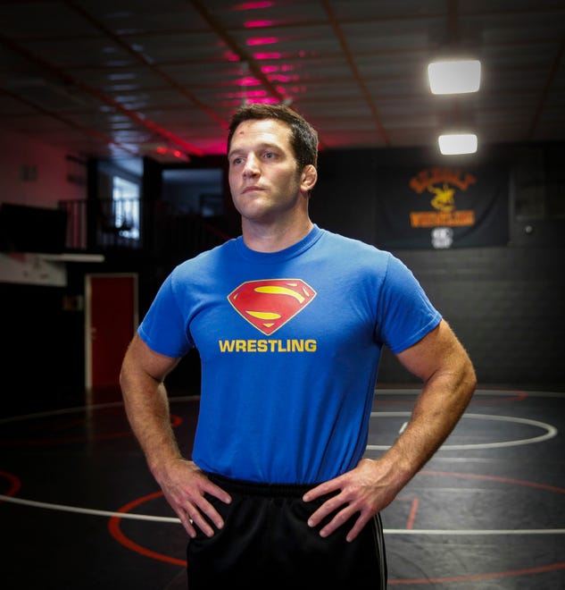 T.J. Sebolt, owner and head coach of the Sebolt Wrestling Academy, poses for a photo in the wrestling room of the Grant Robbins Fieldhouse in Jefferson on Tuesday, July 13, 2021.