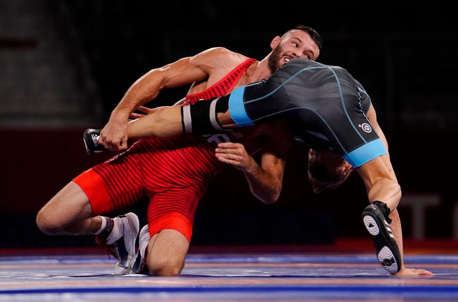 Aug 5, 2021; Chiba, Japan;   Thomas Patrick Gilman (USA) competes against Reza Atrinagharchi (IRI) in th emen's freestyle 57kg bronze medal match during the Tokyo 2020 Olympic Summer Games at Makuhari Messe Hall A. Mandatory Credit: Mandi Wright-USA TODAY Sports