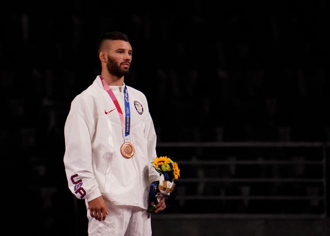 Aug 5, 2021; Chiba, Japan;  Thomas Patrick Gilman (USA) celebrates his bronze medal in the men's freestyle 57kg  during the Tokyo 2020 Olympic Summer Games at Makuhari Messe Hall A. Mandatory Credit: Mandi Wright-USA TODAY Sports