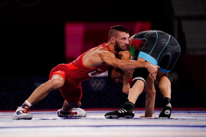 Aug 5, 2021; Chiba, Japan;   Thomas Patrick Gilman (USA) competes against Reza Atrinagharchi (IRI) in the men's freestyle 57kg bronze medal match during the Tokyo 2020 Olympic Summer Games at Makuhari Messe Hall A. Mandatory Credit: Mandi Wright-USA TODAY Sports