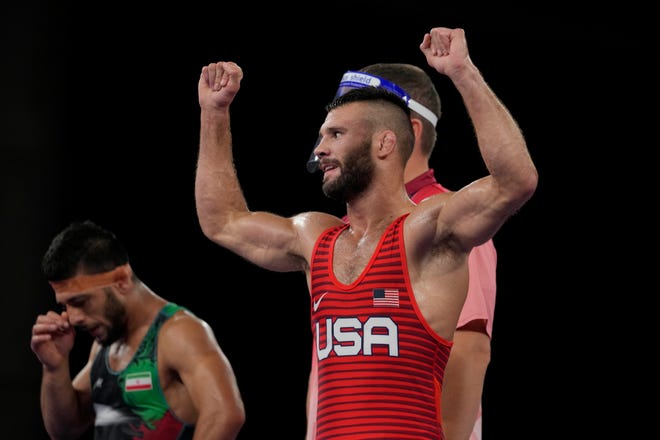 United States' Thomas Patrick Gilman celebrates after defeating Iran's Reza Atrinagharchi during the men's 53kg Freestyle wrestling bronze medal match at the 2020 Summer Olympics, Thursday, Aug. 5, 2021, in Tokyo, Japan. (AP Photo/Aaron Favila)