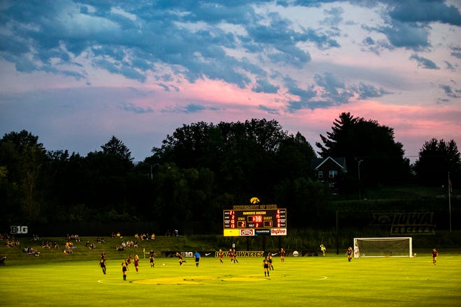 The sun sets as the Iowa Hawkeyes host Iowa State Cyclones during a Cy-Hawk series women's soccer match, Thursday, Aug. 26, 2021, at the University of Iowa Soccer Complex in Iowa City, Iowa.