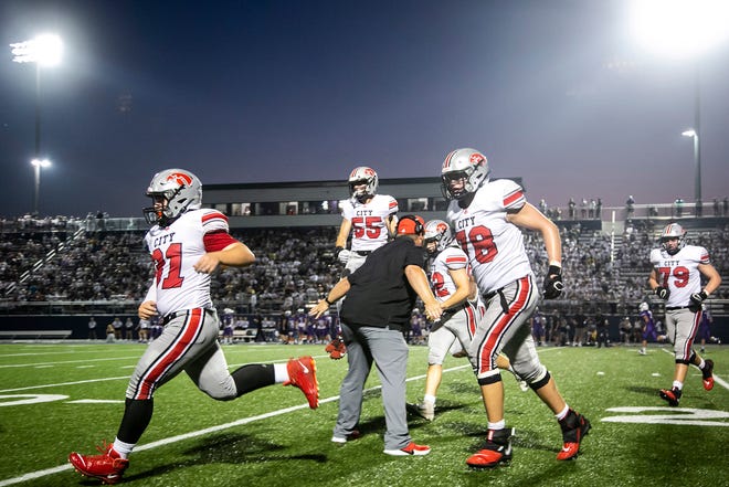 Iowa City High linemen celebrate after a touchdown during a varsity high school football game against Iowa City Liberty, Friday, Aug. 27, 2021, at Liberty High School in North Liberty, Iowa.
