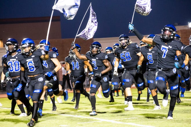 The Chandler Wolves take the field before the Chandler vs. Centennial Coyotes high school football game at Austin Field in Chandler, Sept. 3, 2021.