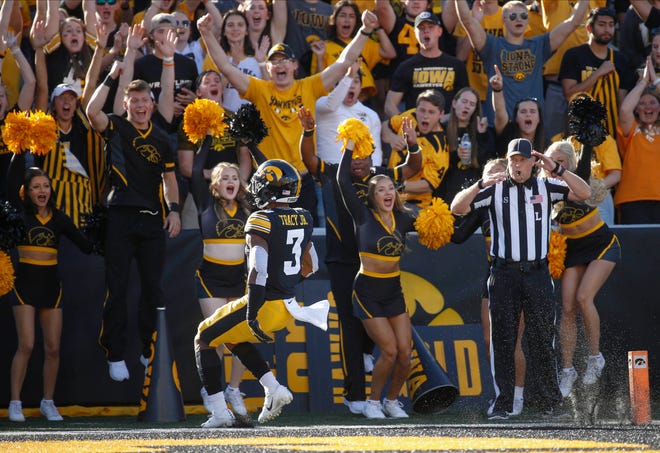 Iowa junior wide receiver Tyrone Tracy Jr., scores a touchdown to excite the student fans in the third quarter against Colorado State at Kinnick Stadium in Iowa City, Iowa, on Saturday, Sept. 25, 2021.