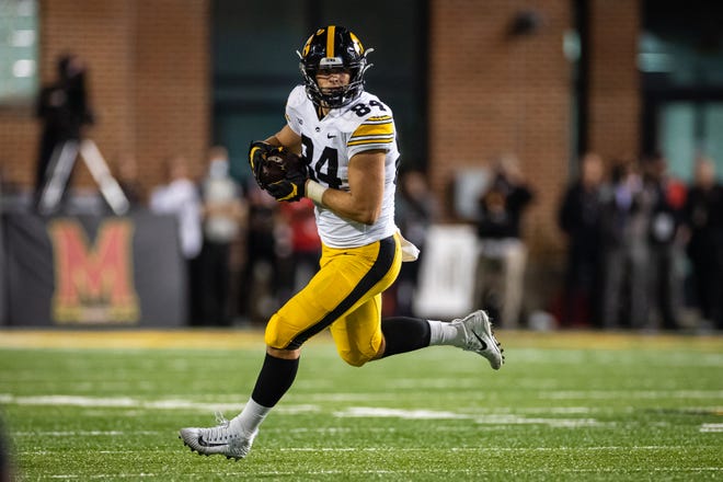 Iowa Hawkeyes tight end Sam LaPorta (84) runs after a catch against the Maryland Terrapins during an NCAA college football game, Friday, Oct. 1, 2021, at Capital One Field at Maryland Stadium in College Park, Maryland.