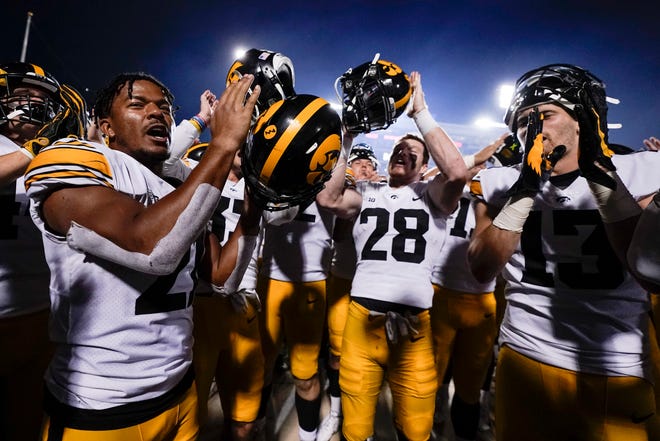 Iowa players celebrate after defeating Maryland 51-14 during an NCAA college football game, Friday, Oct. 1, 2021, at Capital One Field at Maryland Stadium in College Park, Maryland.