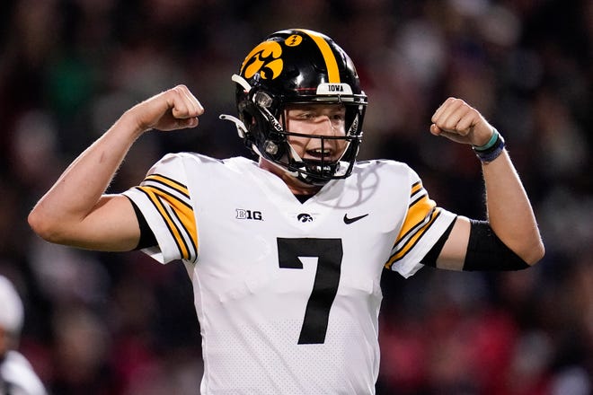 Iowa quarterback Spencer Petras flexes after a play against Maryland during an NCAA college football game, Friday, Oct. 1, 2021, at Capital One Field at Maryland Stadium in College Park, Maryland.