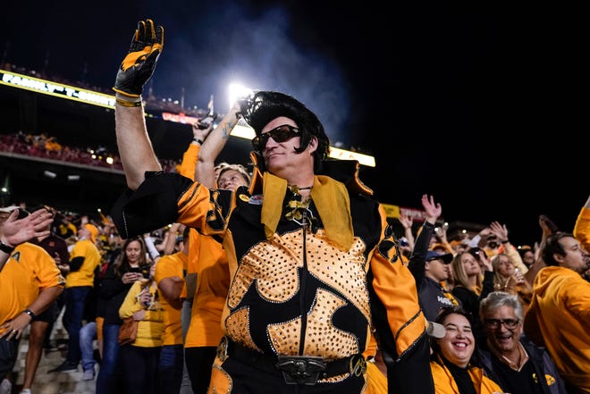 Greg Suckow, otherwise known as Hawkeye Elvis, reacts during an NCAA college football game, Friday, Oct. 1, 2021, at Capital One Field at Maryland Stadium in College Park, Maryland.