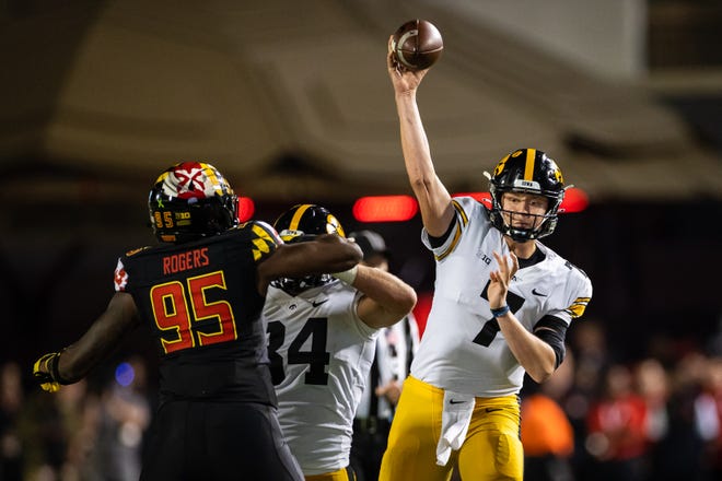 Iowa Hawkeyes quarterback Spencer Petras (7) attempts a pass against the Maryland Terrapins during an NCAA college football game, Friday, Oct. 1, 2021, at Capital One Field at Maryland Stadium in College Park, Maryland.