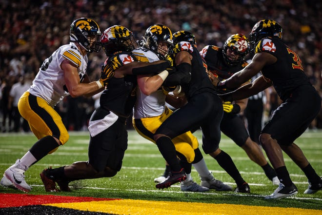 Iowa Hawkeyes fullback Monte Pottebaum (38) scores a touchdown against the Maryland Terrapins during an NCAA college football game, Friday, Oct. 1, 2021, at Capital One Field at Maryland Stadium in College Park, Maryland.