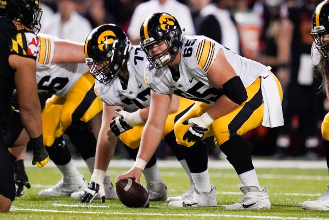 Iowa center Tyler Linderbaum prepares to snap the ball against Maryland during an NCAA college football game, Friday, Oct. 1, 2021, at Capital One Field at Maryland Stadium in College Park, Maryland.