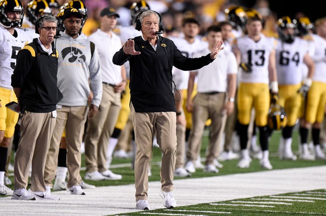 Iowa head coach Kirk Ferentz, center, reacts during an NCAA college football game, Friday, Oct. 1, 2021, at Capital One Field at Maryland Stadium in College Park, Maryland.