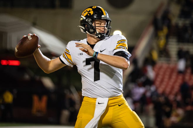 Iowa Hawkeyes quarterback Spencer Petras (7) throws against the Maryland Terrapins during an NCAA college football game, Friday, Oct. 1, 2021, at Capital One Field at Maryland Stadium in College Park, Maryland.
