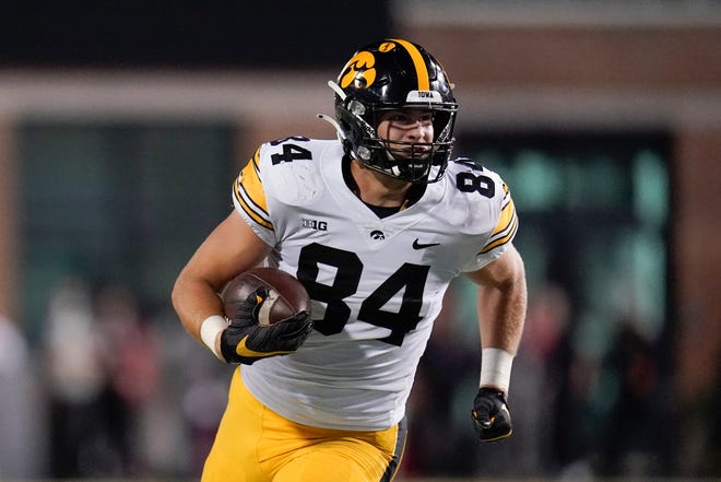 Iowa tight end Sam LaPorta runs with the ball after making a catch against Maryland during an NCAA college football game, Friday, Oct. 1, 2021, at Capital One Field at Maryland Stadium in College Park, Maryland.