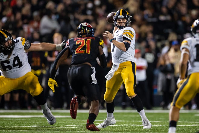 Iowa Hawkeyes quarterback Spencer Petras (7) attempts a pass against the Maryland Terrapins during an NCAA college football game, Friday, Oct. 1, 2021, at Capital One Field at Maryland Stadium in College Park, Maryland.
