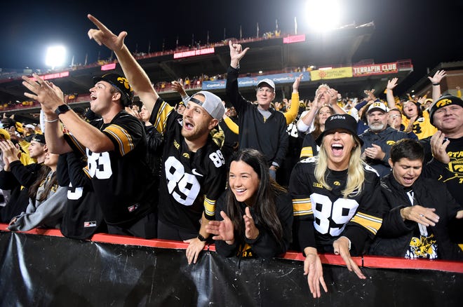 Iowa Hawkeyes fans celebrate after a 51-14 victory after an NCAA college football game, Friday, Oct. 1, 2021, at Capital One Field at Maryland Stadium in College Park, Maryland.