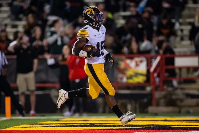 Iowa Hawkeyes running back Tyler Goodson (15) scores a touchdown against the Maryland Terrapins during an NCAA college football game, Friday, Oct. 1, 2021, at Capital One Field at Maryland Stadium in College Park, Maryland.