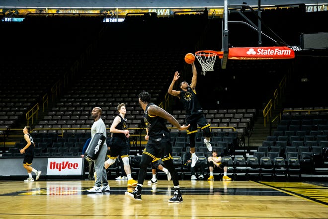 Iowa guard Tony Perkins (11) makes a basket during NCAA men's basketball practice, Monday, Oct. 11, 2021, at Carver-Hawkeye Arena in Iowa City, Iowa.