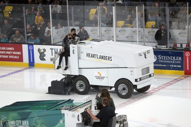 Fans ride zambonis during the Heartlanders’ game against Kansas City at the Xtream Arena in Coralville on Friday, Oct. 22, 2021. The Heartlanders won, 7-4.