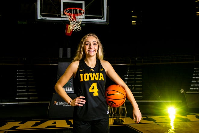 Iowa guard Kylie Feuerbach (4) poses for a photo during Hawkeyes NCAA college women's basketball media day, Thursday, Oct. 28, 2021, at Carver-Hawkeye Arena in Iowa City, Iowa.