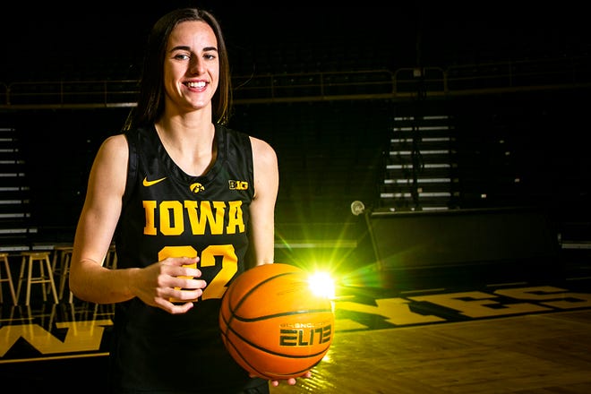 Iowa guard Caitlin Clark (22) poses for a photo during Hawkeyes NCAA college women's basketball media day, Thursday, Oct. 28, 2021, at Carver-Hawkeye Arena in Iowa City, Iowa.