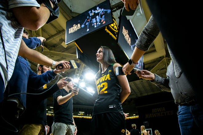 Iowa guard Caitlin Clark (22) speaks to reporters during Hawkeyes NCAA college women's basketball media day, Thursday, Oct. 28, 2021, at Carver-Hawkeye Arena in Iowa City, Iowa.