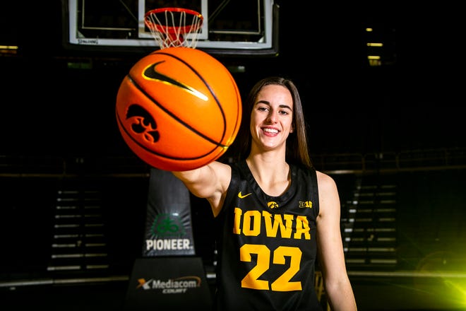 Iowa guard Caitlin Clark (22) poses for a photo during Hawkeyes NCAA college women's basketball media day, Thursday, Oct. 28, 2021, at Carver-Hawkeye Arena in Iowa City, Iowa.
