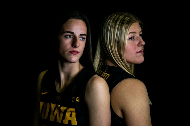 Iowa guard Caitlin Clark, left, and center Monika Czinano pose for a photo during Hawkeyes NCAA college women's basketball media day, Thursday, Oct. 28, 2021, at Carver-Hawkeye Arena in Iowa City, Iowa.