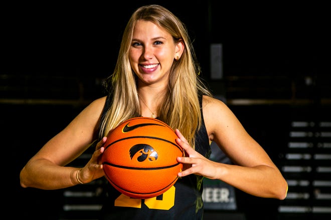 Iowa forward Logan Cook (23) poses for a photo during Hawkeyes NCAA college women's basketball media day, Thursday, Oct. 28, 2021, at Carver-Hawkeye Arena in Iowa City, Iowa.