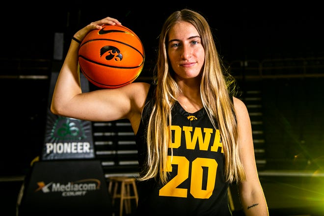 Iowa guard Kate Martin (20) poses for a photo during Hawkeyes NCAA college women's basketball media day, Thursday, Oct. 28, 2021, at Carver-Hawkeye Arena in Iowa City, Iowa.
