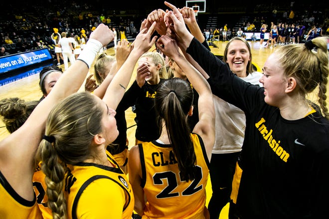 Iowa Hawkeyes players huddle up during a NCAA women's basketball exhibition game against Truman State, Thursday, Nov. 4, 2021, at Carver-Hawkeye Arena in Iowa City, Iowa.