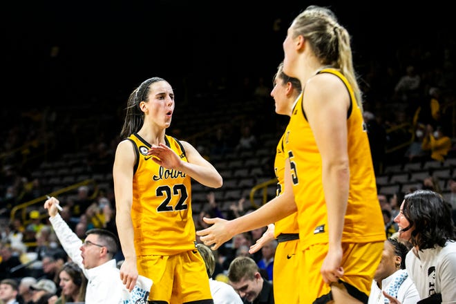 Iowa guard Caitlin Clark (22) celebrates on the bench with teammates Kate Martin and Monika Czinano during a NCAA women's basketball exhibition game against Truman State, Thursday, Nov. 4, 2021, at Carver-Hawkeye Arena in Iowa City, Iowa.