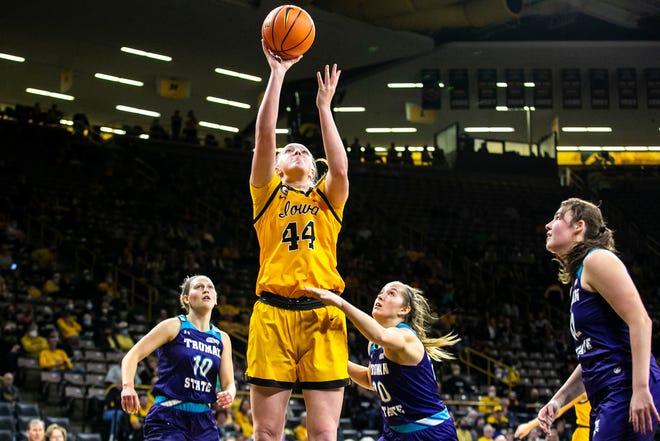 Iowa's Addison O'Grady (44) makes a basket as Truman State's Hannah Pinkston (10) and Emma Bulman defend during a NCAA women's basketball exhibition game, Thursday, Nov. 4, 2021, at Carver-Hawkeye Arena in Iowa City, Iowa.