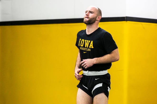 Iowa's Alex Marinelli warms up before a NCAA Hawkeyes men's wrestling intrasquad match, Thursday, Nov. 4, 2021, at the Dan Gable Wrestling Complex in Carver-Hawkeye Arena in Iowa City, Iowa.