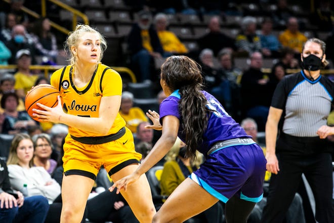 Iowa guard Sydney Affolter, left, looks to pass as Truman State's Brioenne Burns (11) defends during a NCAA women's basketball exhibition game, Thursday, Nov. 4, 2021, at Carver-Hawkeye Arena in Iowa City, Iowa.