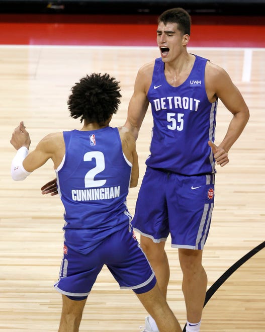Detroit Pistons players Cade Cunningham (2) and Luka Garza (55) celebrate after Garza scored against the Houston Rockets during the 2021 NBA Summer League at the Thomas & Mack Center on August 10, 2021 in Las Vegas, Nevada.