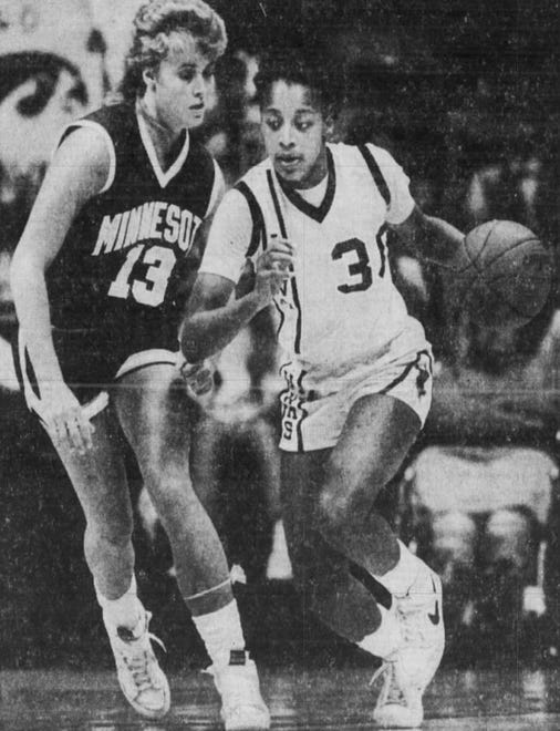 Iowa's Michelle Edwards gets a fast break against Minnesota's Debbie Hilmerson during a women's basketball game in this 1987 photo at Carver-Hawkeye Arena in Iowa City, Iowa.