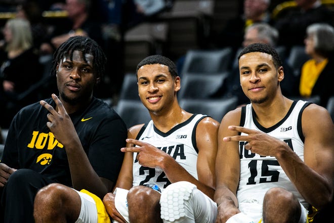 Iowa Hawkeyes players, from left, Josh Ogundele, Kris Murray and Keegan Murray pose for a photo during a NCAA non-conference men's basketball game against Longwood, Tuesday, Nov. 9, 2021, at Carver-Hawkeye Arena in Iowa City, Iowa.