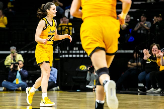 Iowa guard Caitlin Clark (22) smiles after making a basket during a NCAA non-conference women's basketball game against New Hampshire, Tuesday, Nov. 9, 2021, at Carver-Hawkeye Arena in Iowa City, Iowa.