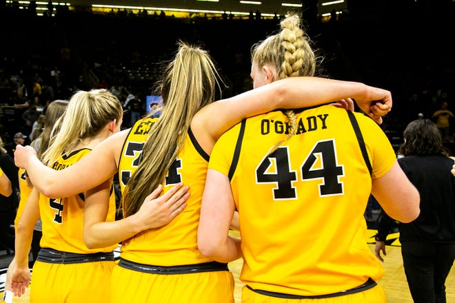 Iowa guard Kylie Feuerbach (4) forward AJ Ediger (34) and Addison O'Grady (44) walk off the court together after a NCAA non-conference women's basketball game against New Hampshire, Tuesday, Nov. 9, 2021, at Carver-Hawkeye Arena in Iowa City, Iowa.