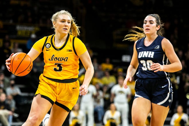 Iowa guard Sydney Affolter (3) drives to the basket as New Hampshire's Ella Fiore (30) defends during a NCAA non-conference women's basketball game, Tuesday, Nov. 9, 2021, at Carver-Hawkeye Arena in Iowa City, Iowa.