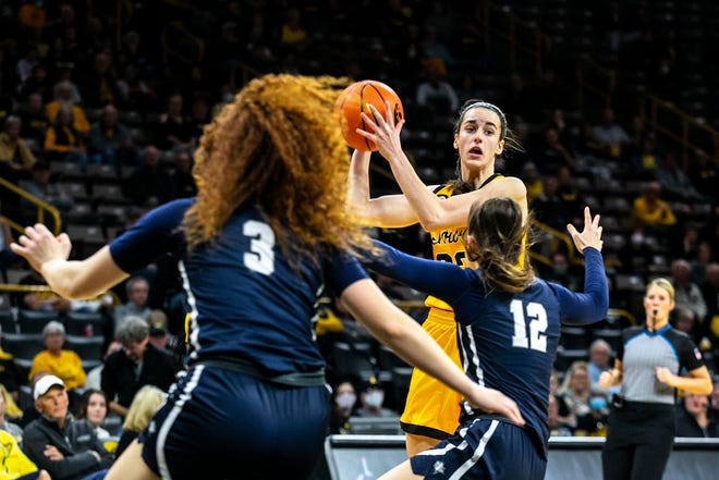 Iowa guard Caitlin Clark (22) looks to pass during a NCAA non-conference women's basketball game against New Hampshire, Tuesday, Nov. 9, 2021, at Carver-Hawkeye Arena in Iowa City, Iowa.