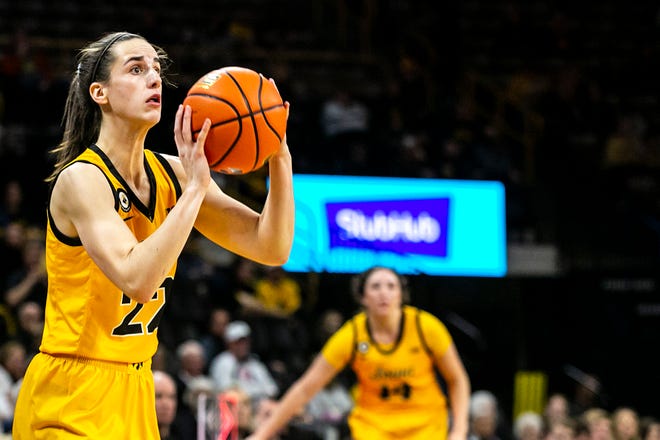 Iowa guard Caitlin Clark (22) makes a 3-point basket during a NCAA non-conference women's basketball game against New Hampshire, Tuesday, Nov. 9, 2021, at Carver-Hawkeye Arena in Iowa City, Iowa.