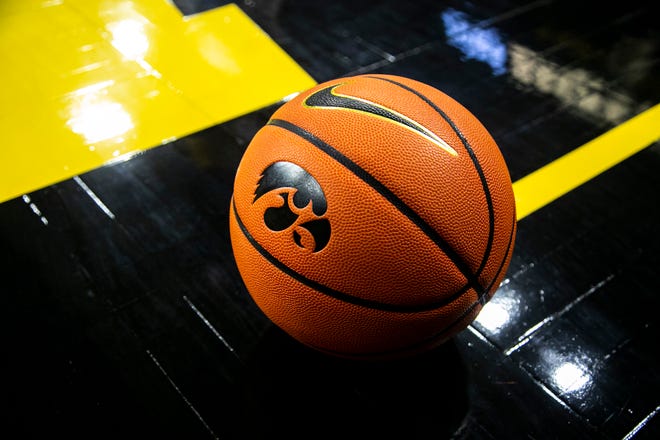 A basketball with an Iowa Hawkeyes Tigerhawk logo is seen courtside before a basketball before a NCAA non-conference women's basketball game, Tuesday, Nov. 9, 2021, at Carver-Hawkeye Arena in Iowa City, Iowa.