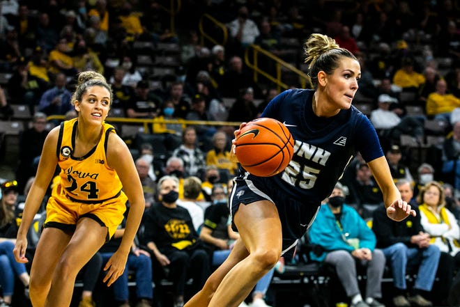 New Hampshire's Sophia Widmeyer, right, gets a steal against Iowa guard Gabbie Marshall (24) during a NCAA non-conference women's basketball game, Tuesday, Nov. 9, 2021, at Carver-Hawkeye Arena in Iowa City, Iowa.