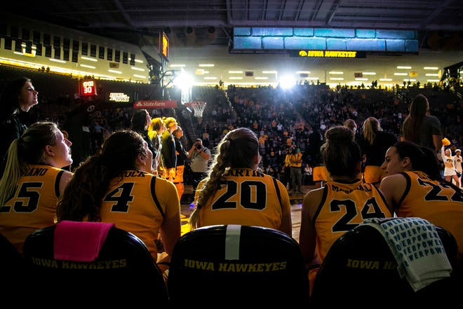 Iowa Hawkeyes players, from left, Monika Czinano, McKenna Warnock, Kate Martin, Gabbie Marshall and Caitlin Clark wait to be introduced during a NCAA non-conference women's basketball game against New Hampshire, Tuesday, Nov. 9, 2021, at Carver-Hawkeye Arena in Iowa City, Iowa.